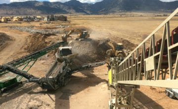 tractors and trucks on work site
