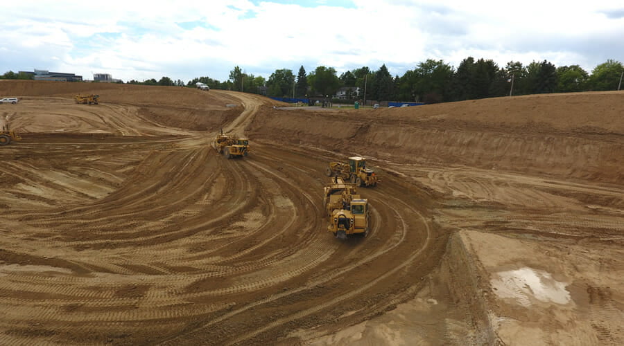 service-sitework-01 tractors driving in dirt
